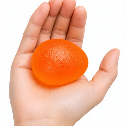 Handträningsboll i orange för daglig handträning och fingerstyrka.