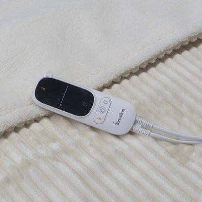 Närbild på Terraillon Koomys digitala fjärrkontroll med knappar för temperatur, på/av och timer